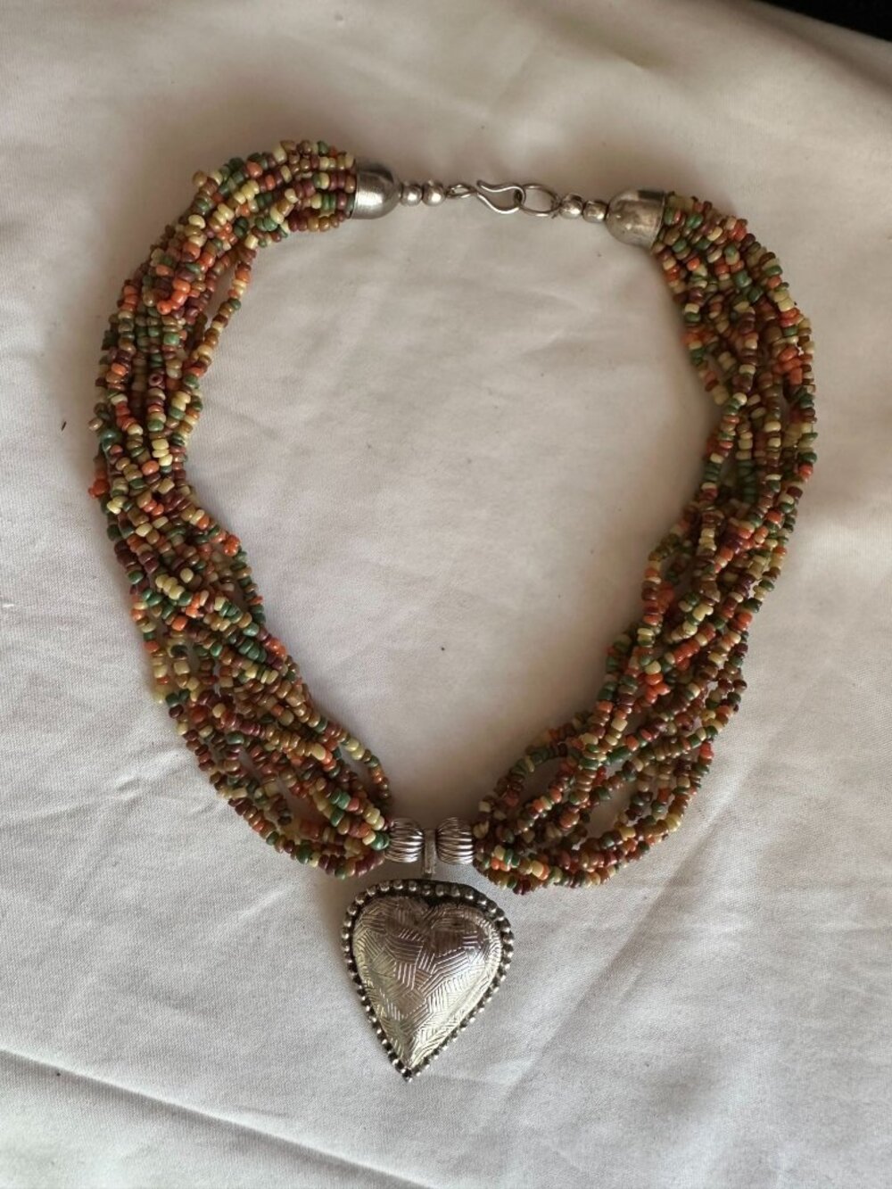 Vintage colorful beaded necklace with silvertone heart pendant